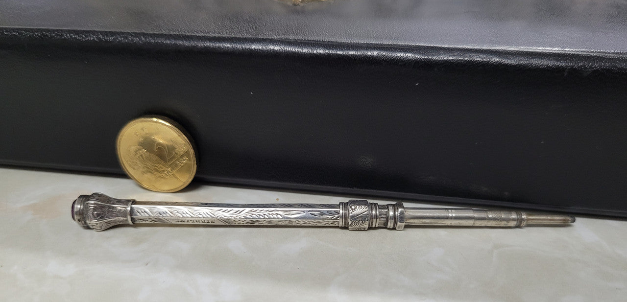 Interesting sterling silver and amethyst propelling and extending pencil. In good original condition, please view photos as they help form part of the description.