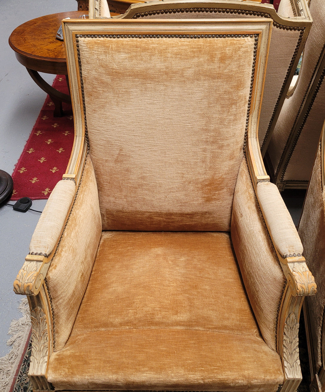 Pair of Louis XVI style painted arm chairs with carving & fluted legs. They have been sourced from France and the fabric is in good used original condition. Please view photos as they help form part of the description.