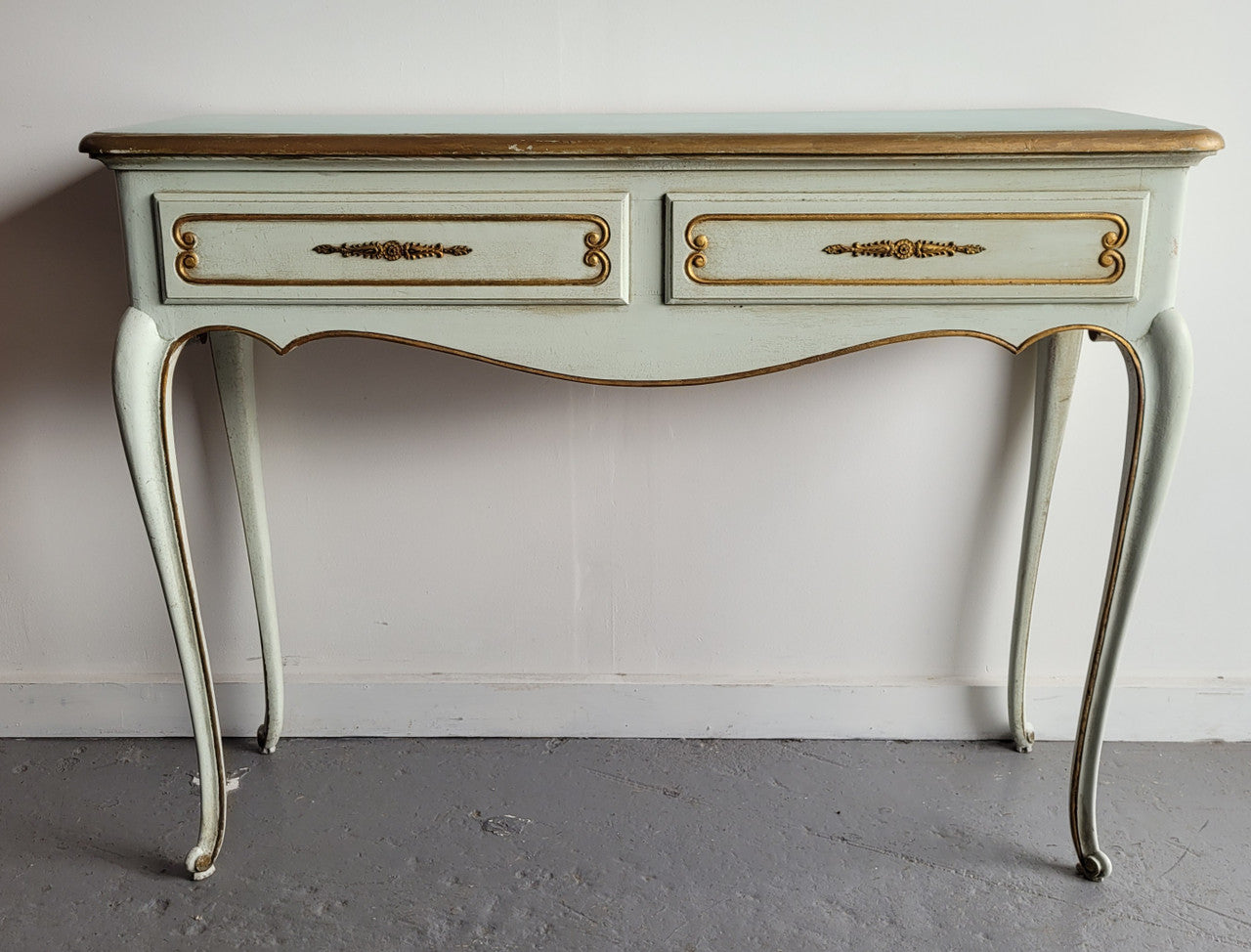 Vintage French Louis 15th style original painted and gilded highlights two drawer console table. It has been sourced from France and is in good original condition.