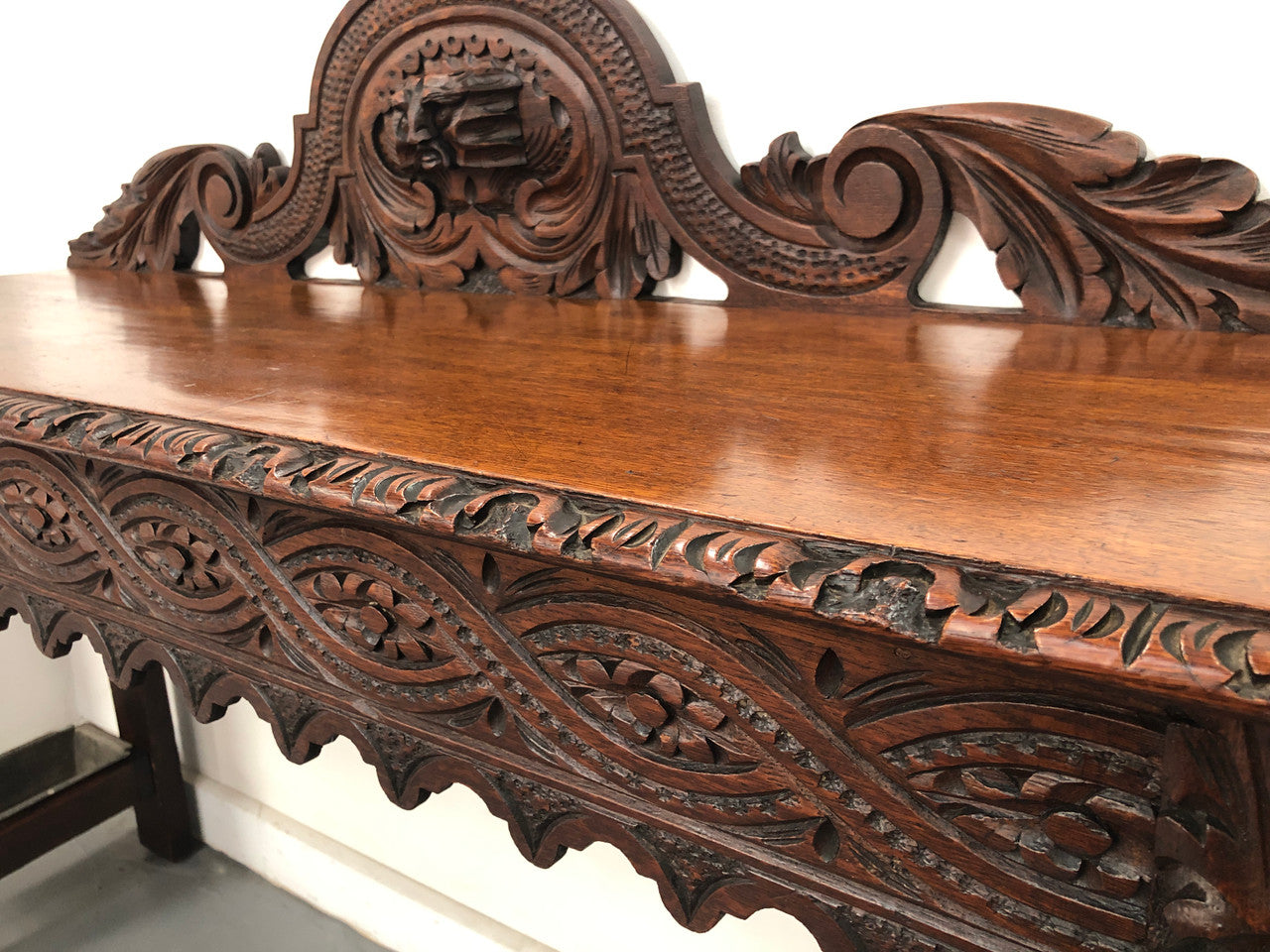 Superb 19th Century Gothic style hall/console table. It has umbrella and walking stick holders on both sides. In good original detailed condition.