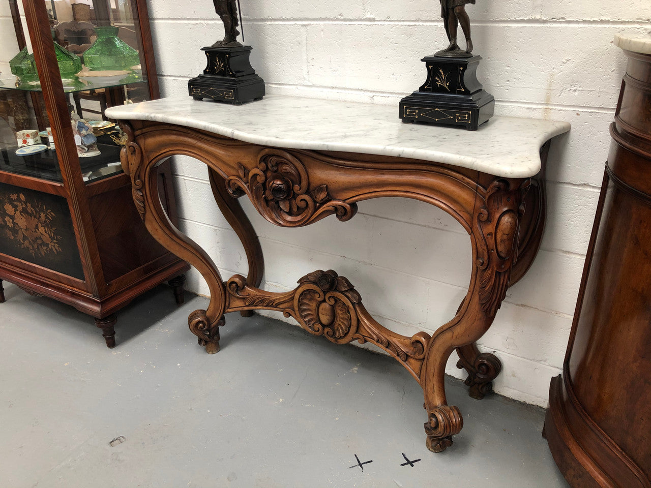 19th Century Louis XV style beautifully carved console table. With detailed ornate carving and a beautiful marble top. In good original detailed condition.