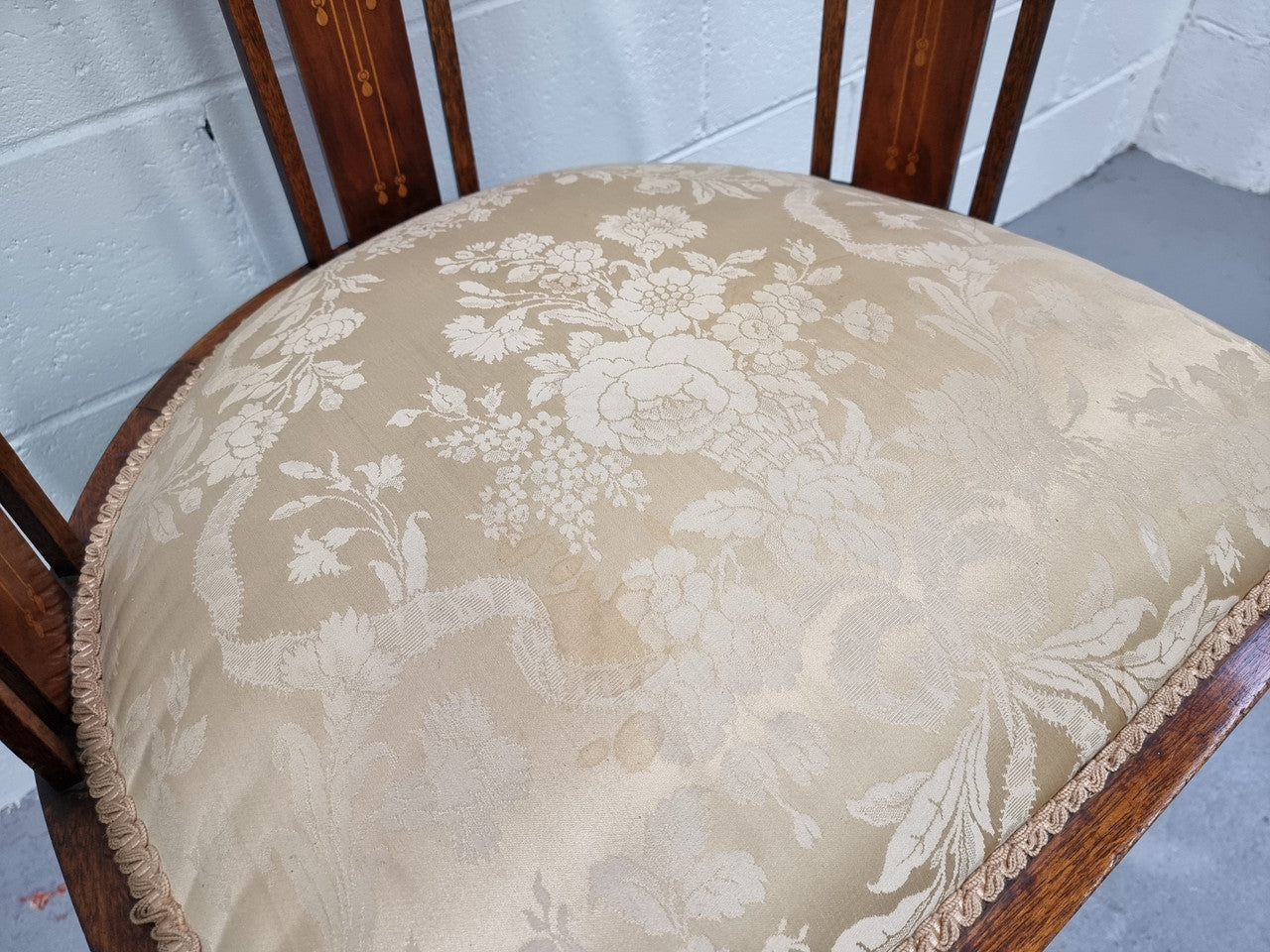 Charming Edwardian inlaid walnut upholstered armchair. In good original condition.