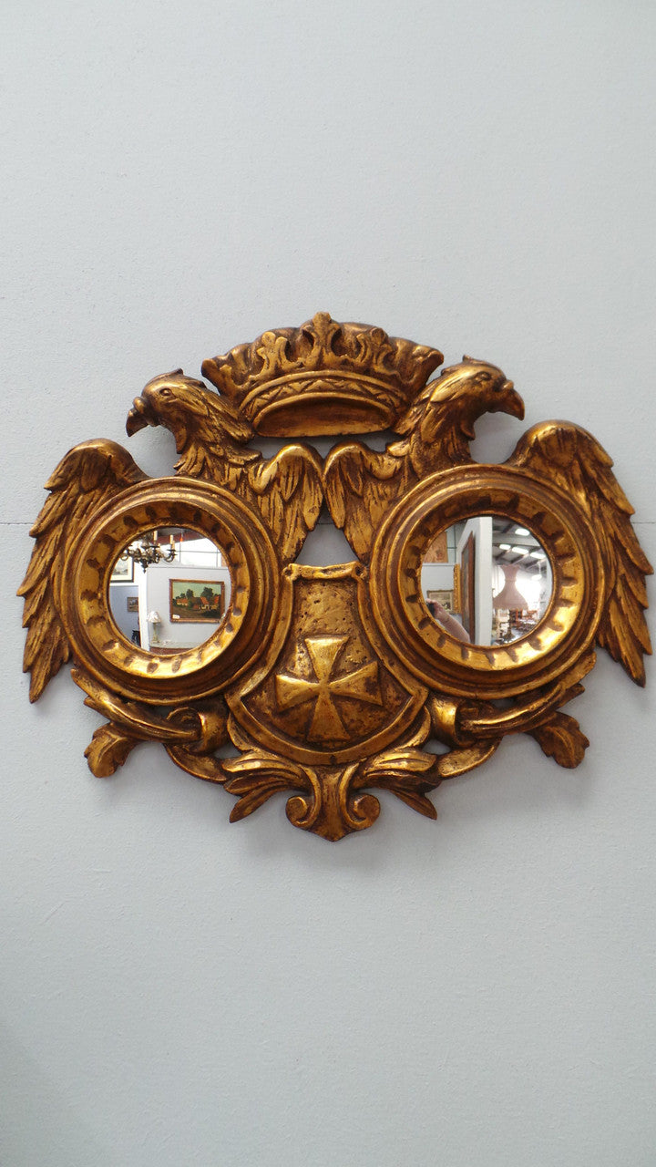 A unique and beautiful hand carved French gilt wood double mirror. It is 47 cm tall and 58 cm wide. From circa 1930 and in excellent restored condition.