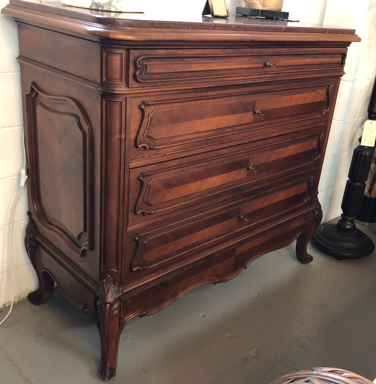 19th Century French Walnut five-drawer marble top commode. In good original detailed condition.