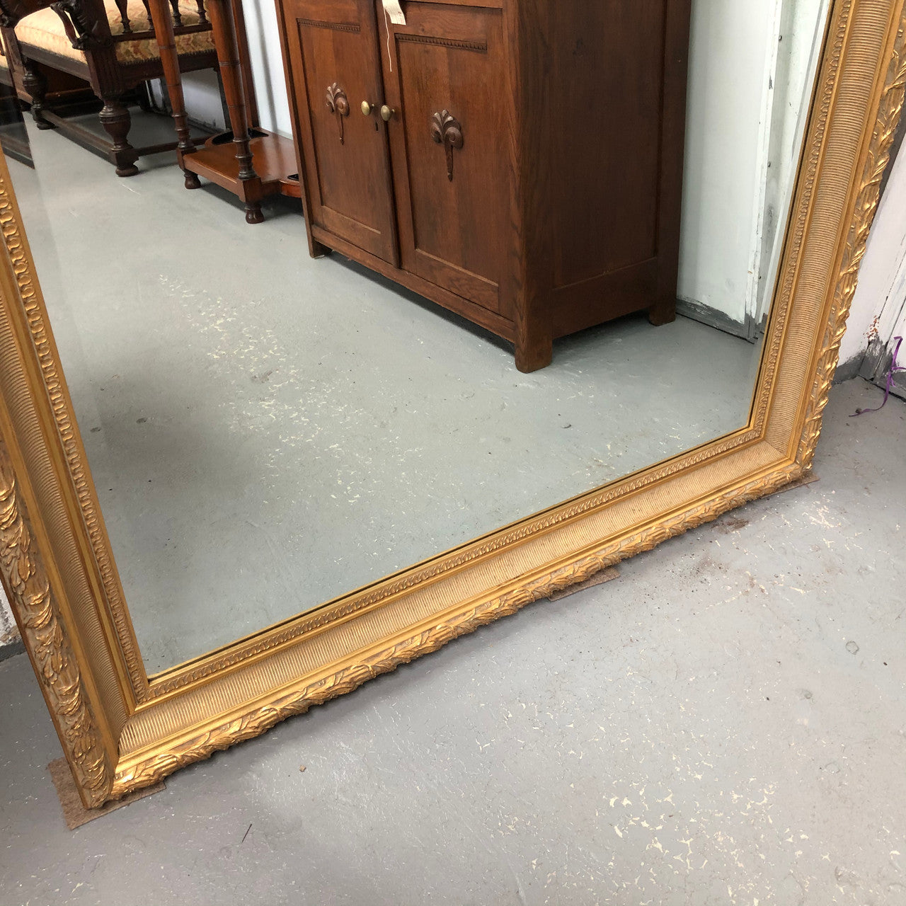 Very large French style mirror with beveled glass. In very good original condition.