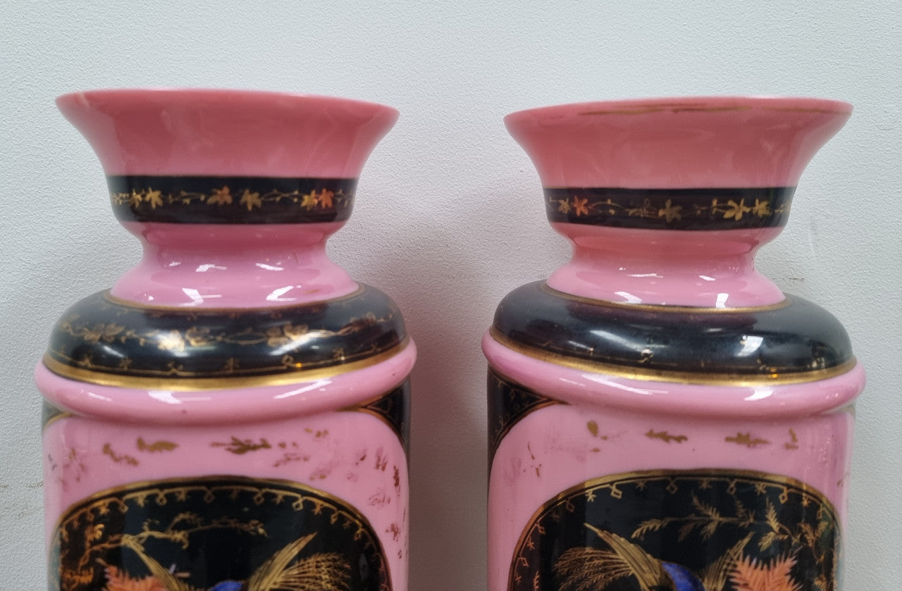 Late Victorian pink and hand painted, enameled pair of vases with some ware to enameling. It is in good original condition.