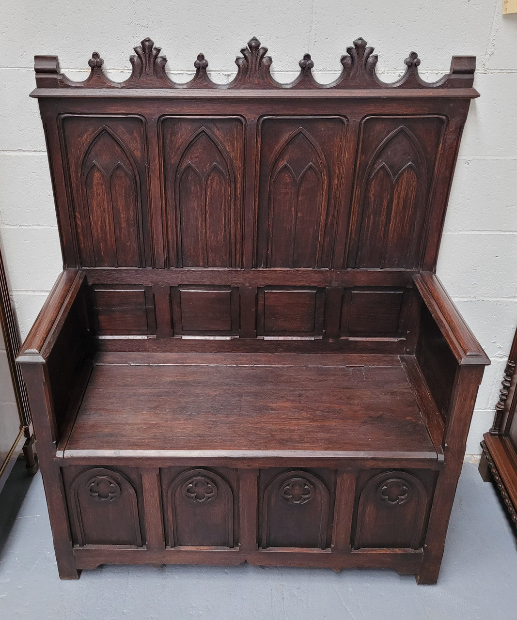 French Oak 19th Century gothic style high backed hall seat. Amazing detailed carving and is good detailed condition.