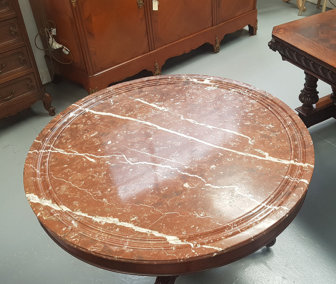 A superb early 19th century French Louis Philippe mahogany centre table, with original round carved rough marble with reeded-edge and is in good original condition.