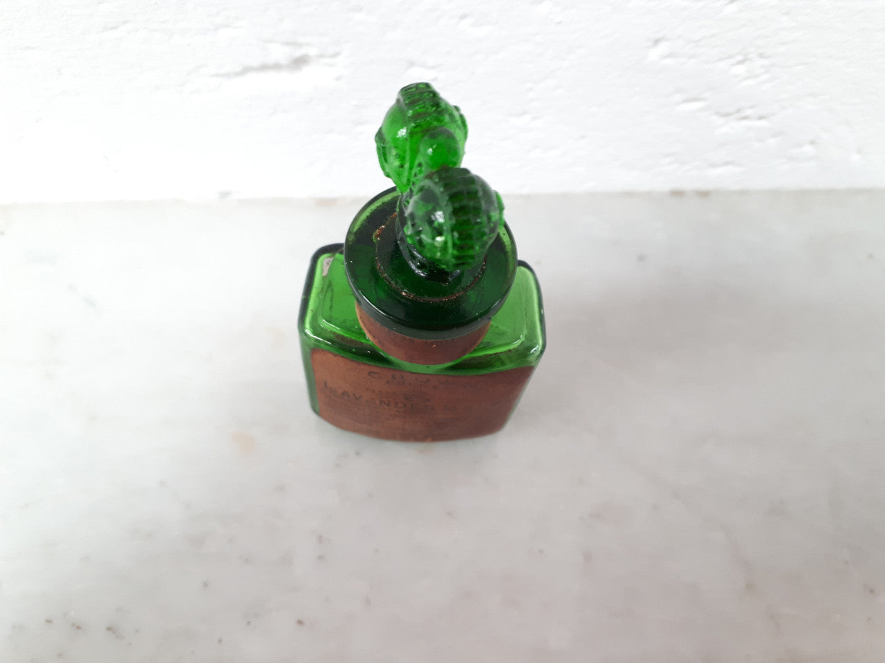 Victorian green glass Crown perfume bottle. In good original condition.