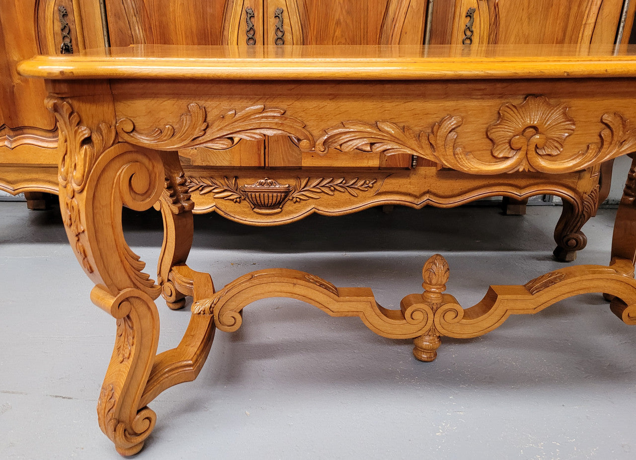 French Oak parquetry top coffee table with decorative carved base. It is in good original detailed condition.