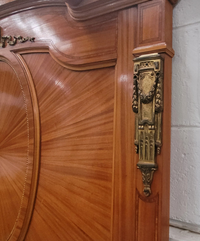 Stunning long Louis XV style satinwood Trumeau mirror decorated with Bronze ormolu mounts. It has its original bevelled mirror and it in good detailed condition. It has been sourced from France.