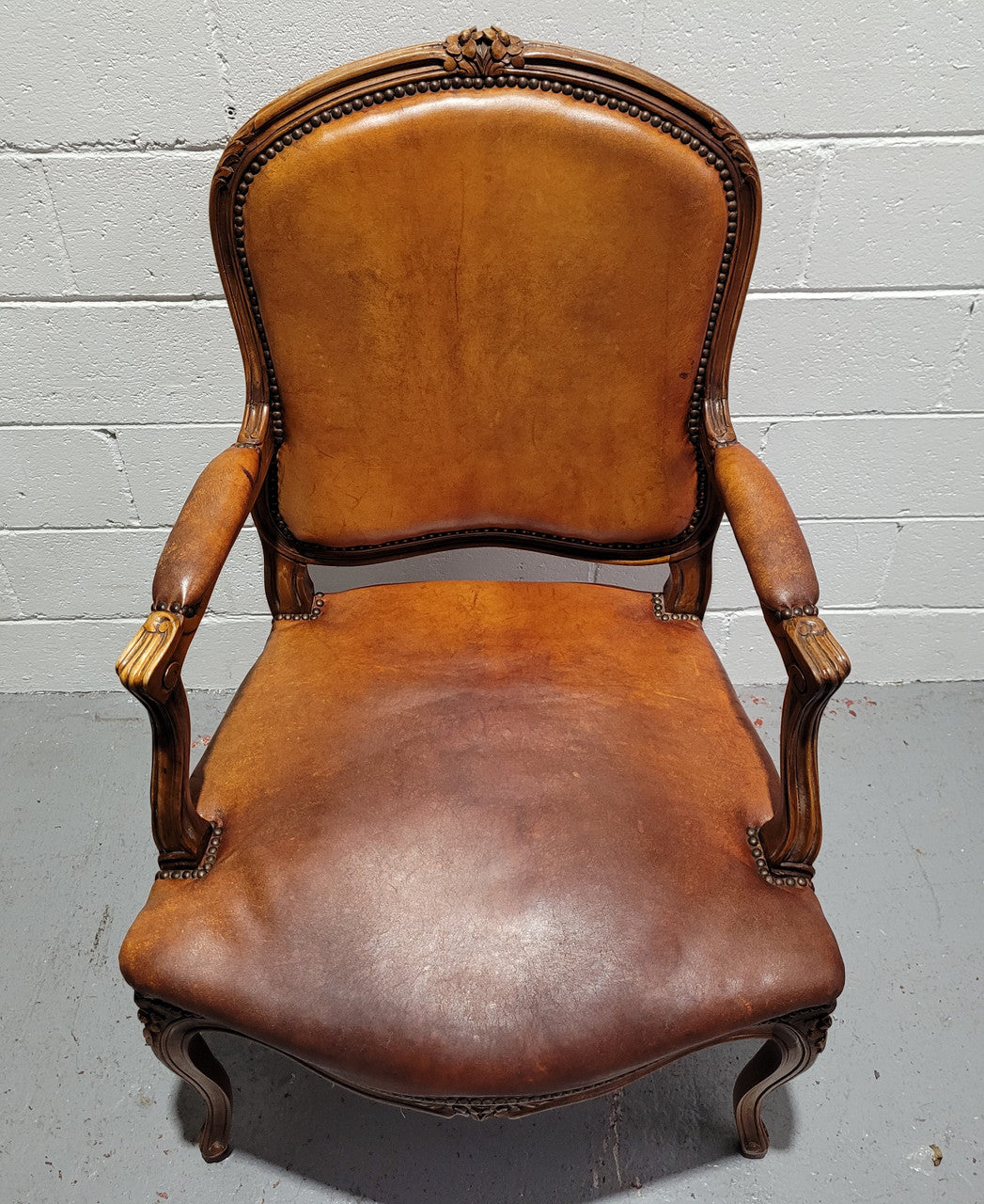 French Walnut Louis XV style desk chair with faux leather upholstery. The upholstery is in good original condition and very comfortable to sit in.
