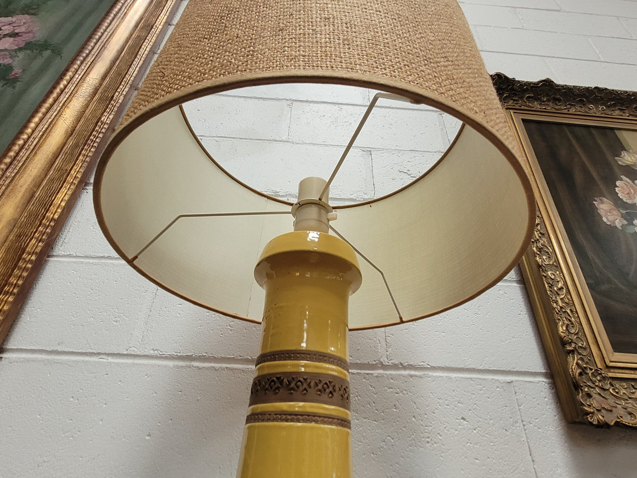 A large and impressive Vintage Mid-Century Bitossi Italian terra cotta lamp base and shade. Incised repeating geometric terra cotta pattern creates a tactile element which is incorporated with stunning shining thick yellow glaze to create the sculptural form of the base.