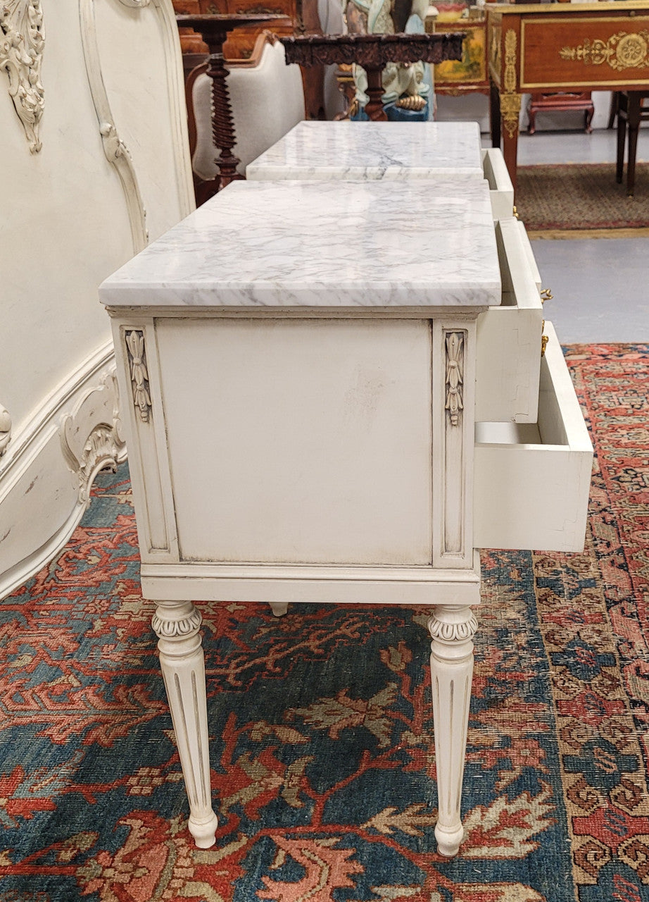 Attractive pair of Vintage French Louis 16th style two drawer marble topped bedsides. They have been sourced from France and are in good original condition.