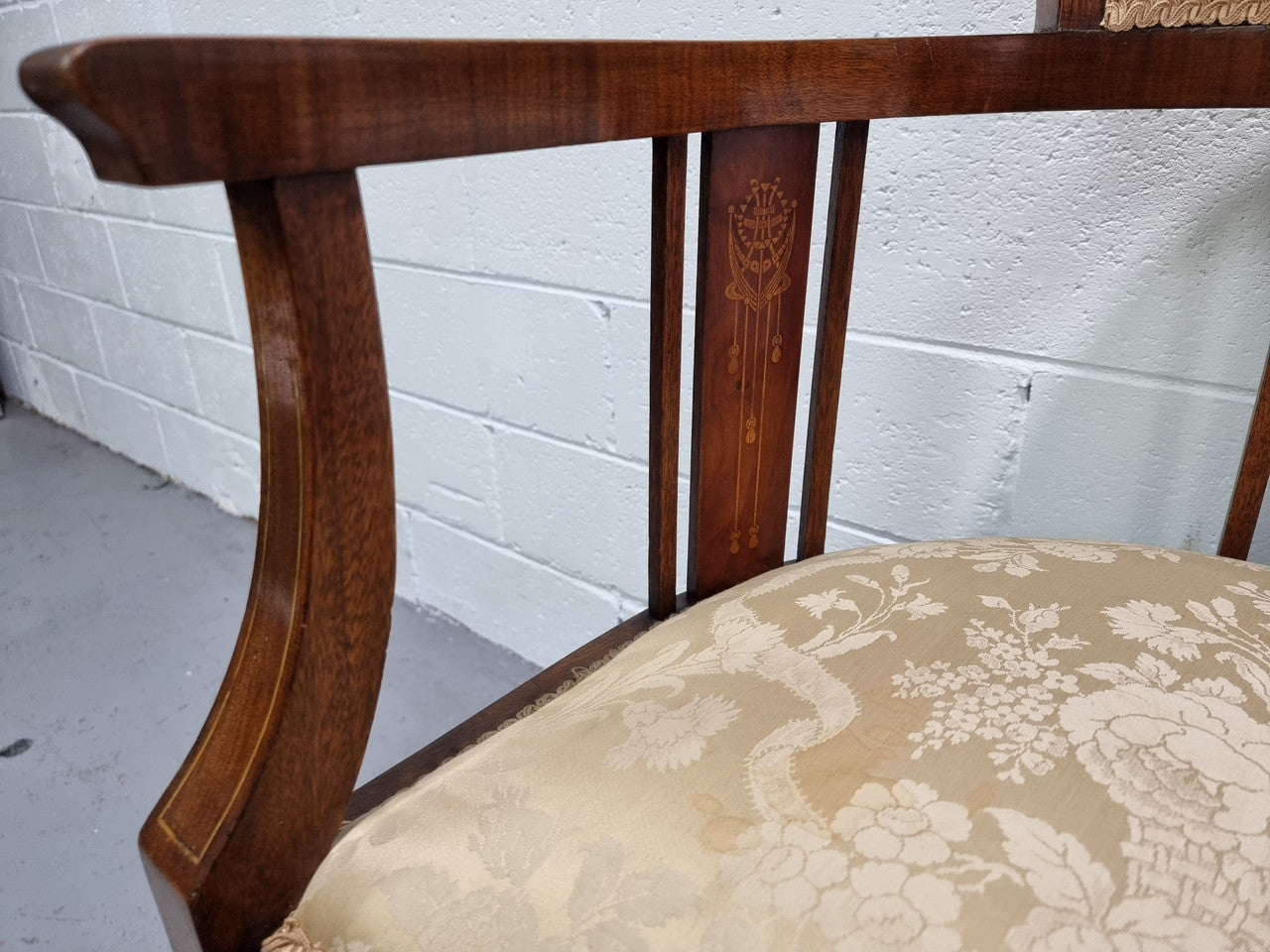 Charming Edwardian inlaid walnut upholstered armchair. In good original condition.