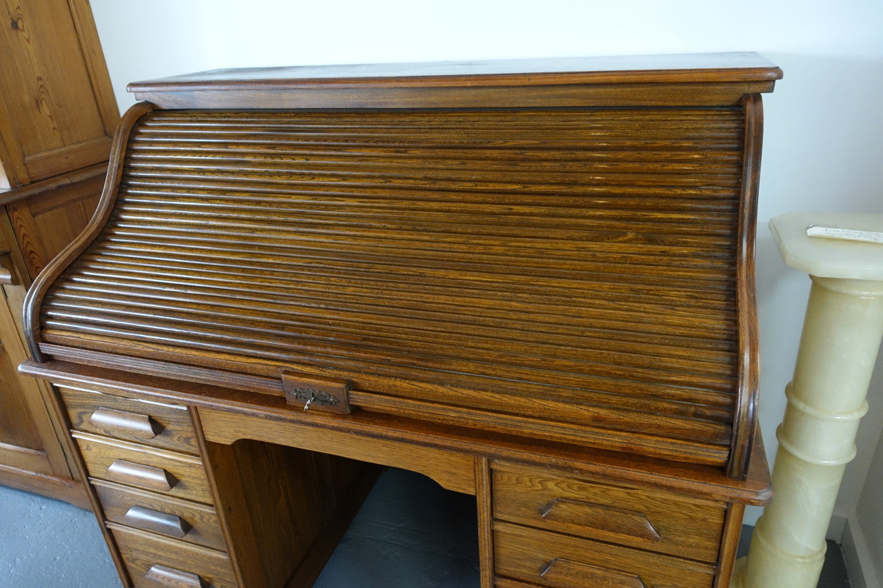 An Antique American Oak Cutler Roll Top Desk