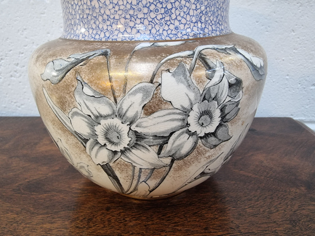 Royal Doulton Biscuit Barrel with silver plated top, handle and lid. Displaying a Daffodil pattern. In original condition please view photo's as they form part of the description.