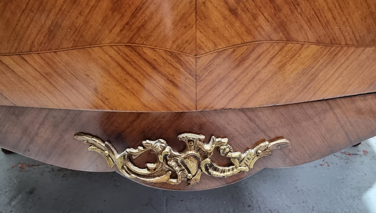Grand French Walnut Louis XV style marble top vitrine. It has two glass shelfs and one mirrored shelf at the bottom and added storage at bottom. It is in good original detailed condition.