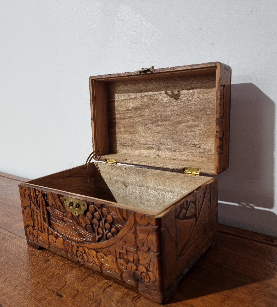 Small Chinese carved camphor wood jewellery box. It is in original condition.