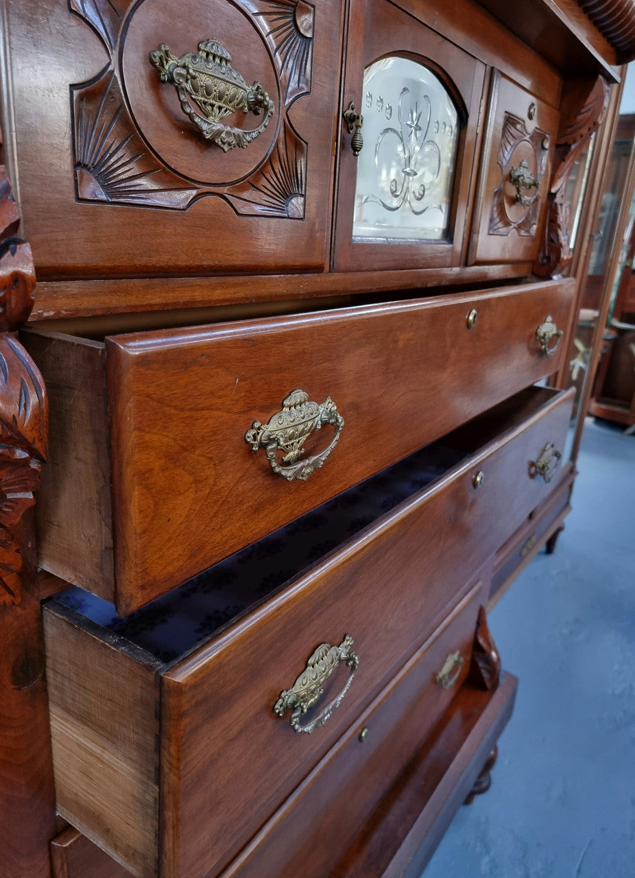 A 19th Century Scottish Mahogany tall boy/ chest of six drawers with small cabinet section at the top. Beautiful carvings and easily comes apart into three sections making transport for moving into place easy. In good original detailed condition.