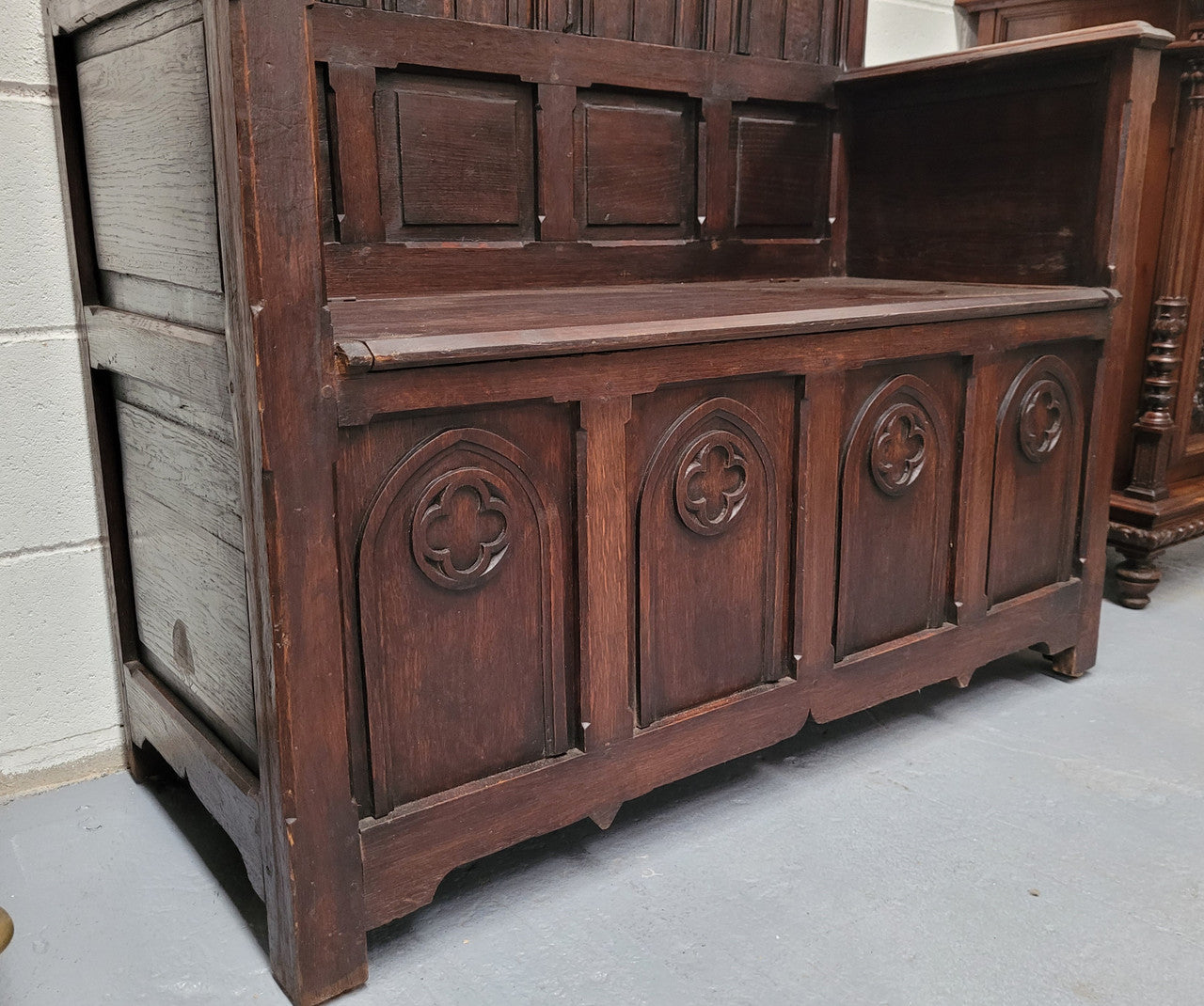 French Oak 19th Century gothic style high backed hall seat. Amazing detailed carving and is good detailed condition.