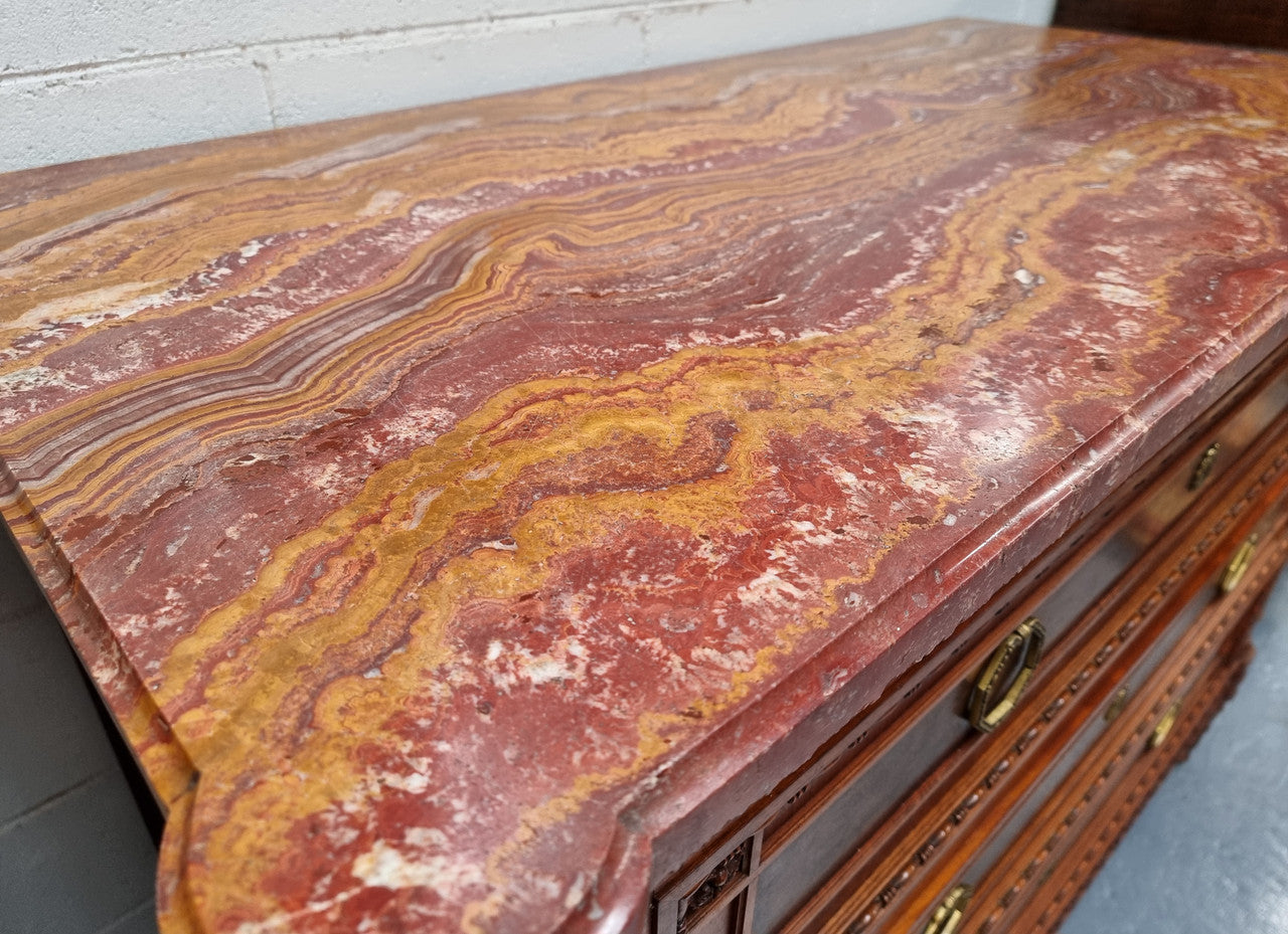 Lovely decorative French walnut and burr Walnut 3 drawer commode with a stunning coloured marble top and lovely carved details. In very good detailed condition.