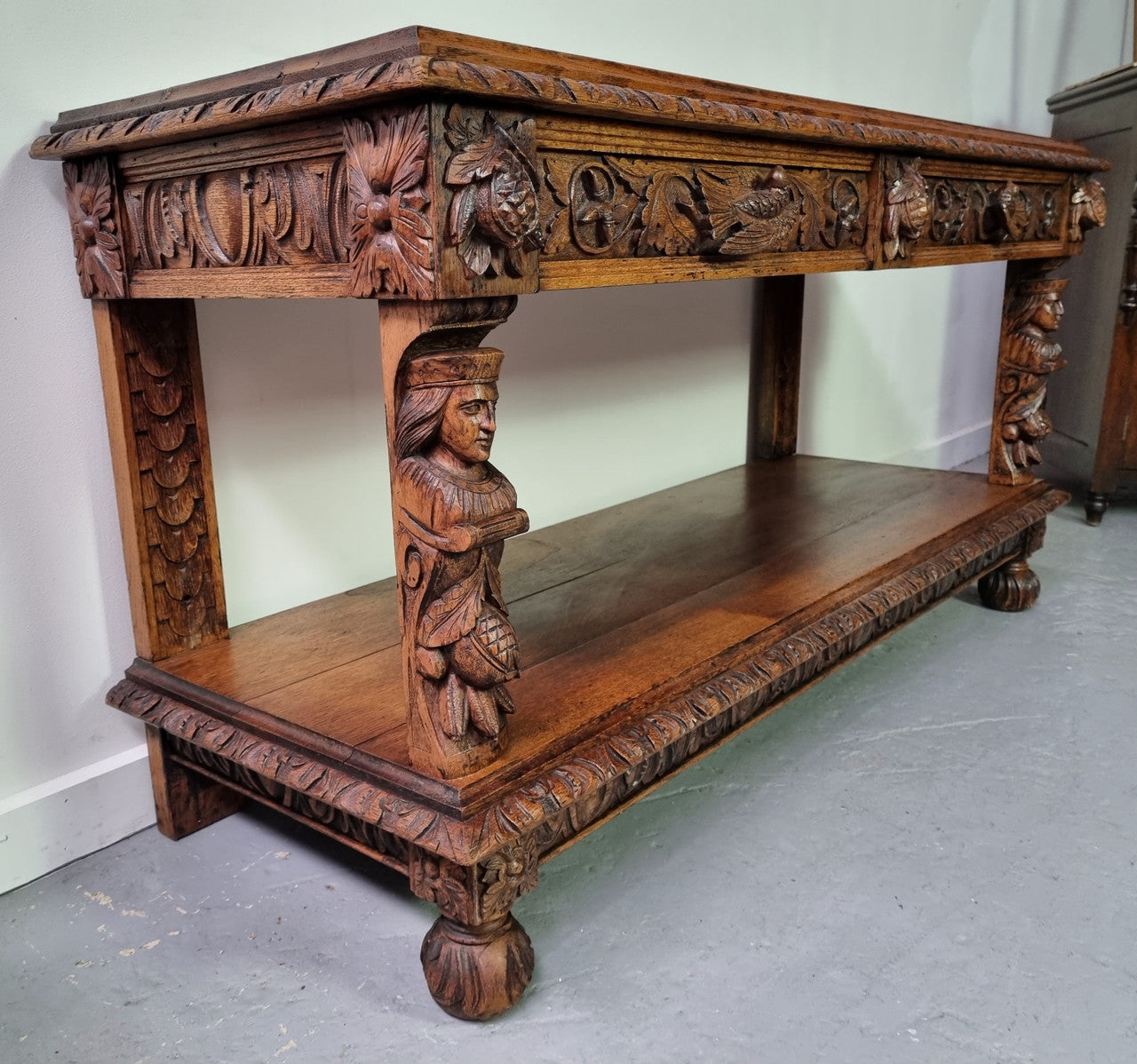 19th Century French Oak Henry the 2nd style console/side table/ TV unit with two drawer with beautiful carvings. It is in good original detailed condition.