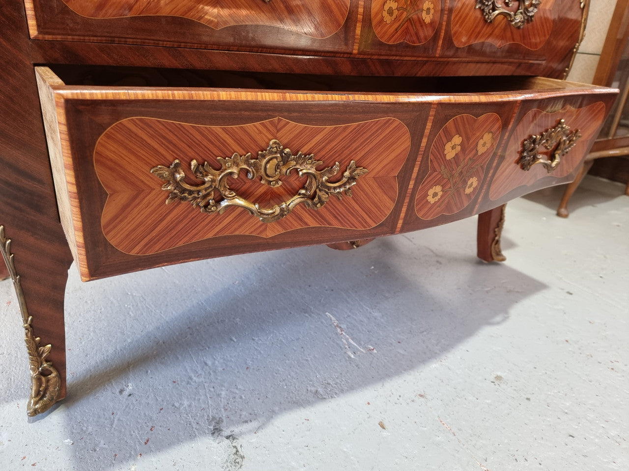 French Walnut and Kingwood Louis XV style marquetry inlaid commode with three drawers and a beautiful marble top. It is in good original detailed condition.