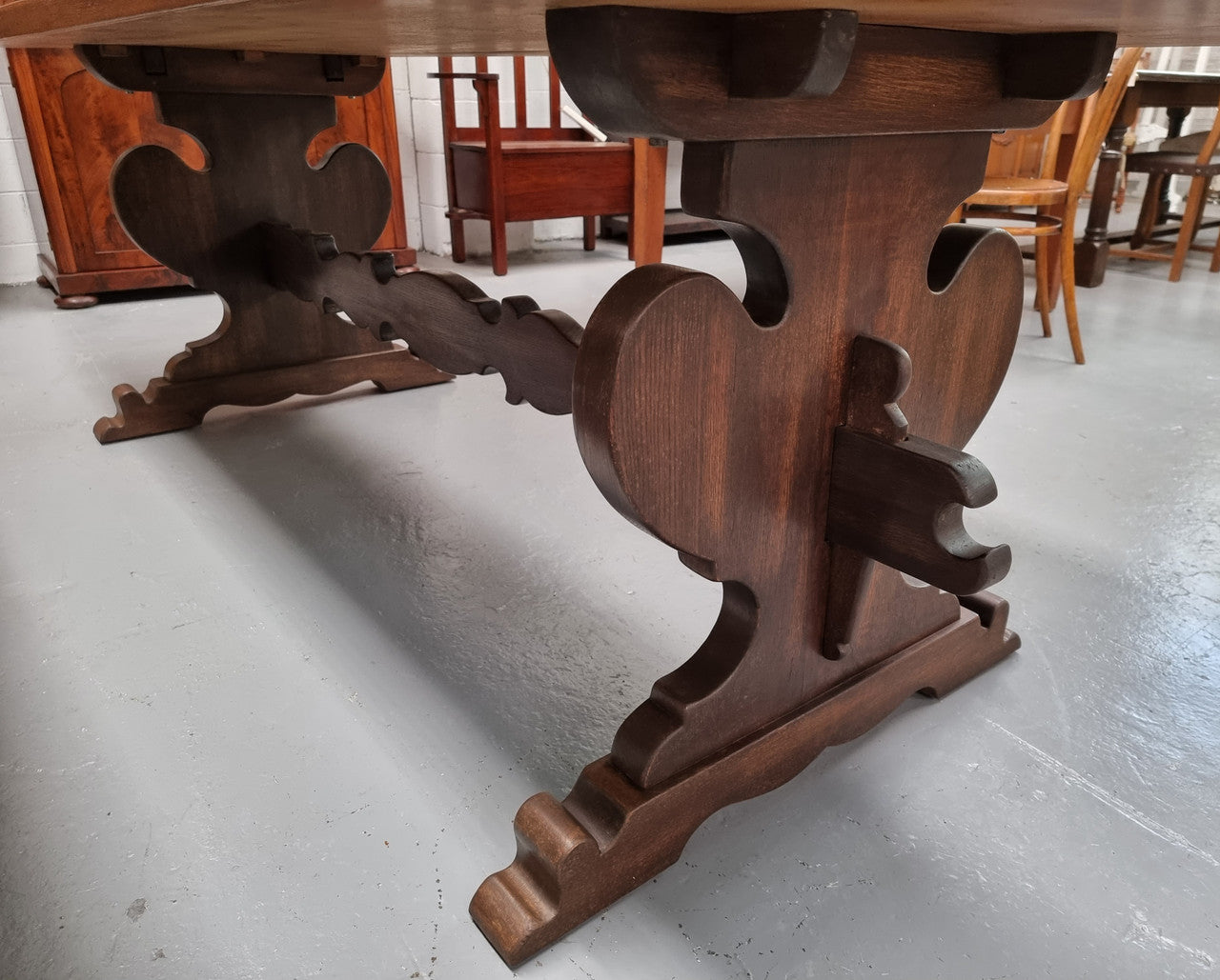 Solid French Oak Monastery sourced directly from France. This table comfortably sits 6-8 people and features a stunning top that is supported on a large trestle base, and united with a single stretcher secured at each end with oak pegs. in good original detailed condition.