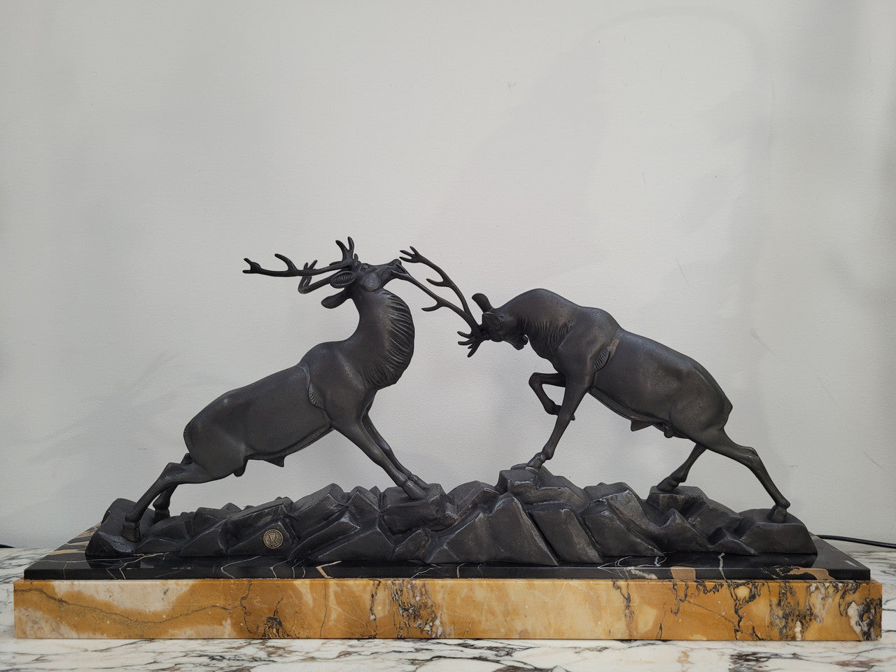 French Art Deco bronzed spelter and marble"Fighting Stags" statue by renowned artist and sculptor "Irenee Rochard".