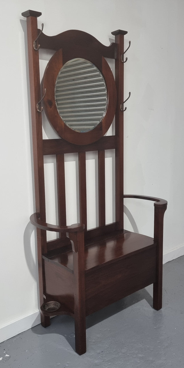 Blackwood Federation hall stand of pleasing narrow proportions. Beautiful round mirror with four lovely hooks and a lift up sit for added storage. In good original condition.