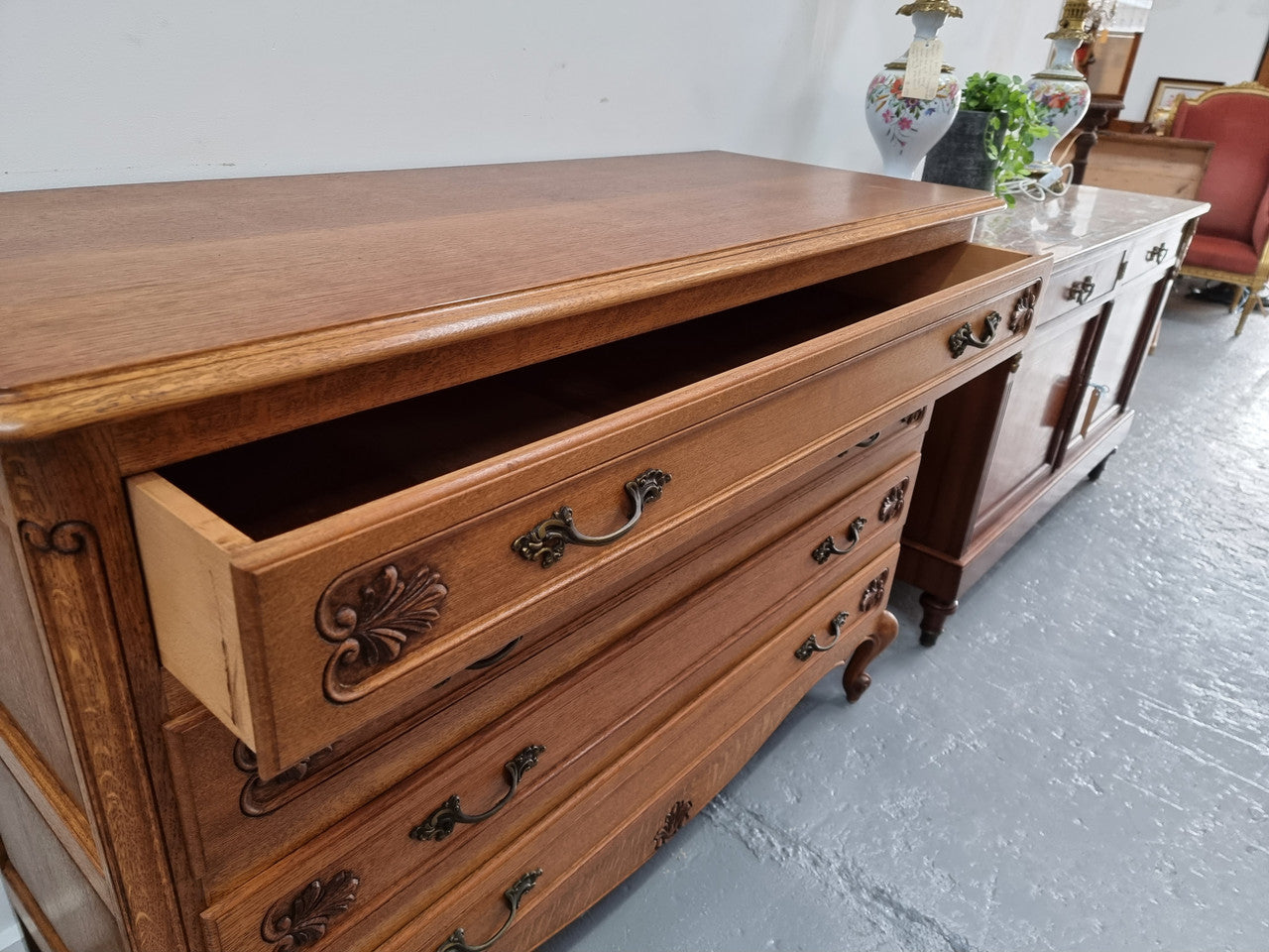 Fabulous French light Oak of chest of four drawers with lovely decorative carving. In good original detailed condition.