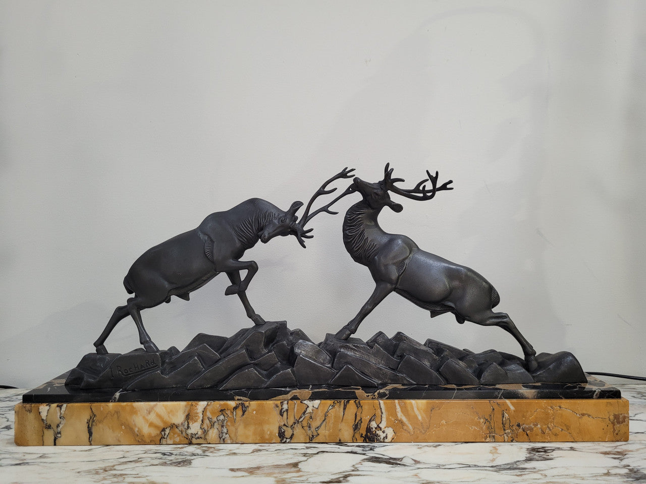 French Art Deco bronzed spelter and marble"Fighting Stags" statue by renowned artist and sculptor "Irenee Rochard".