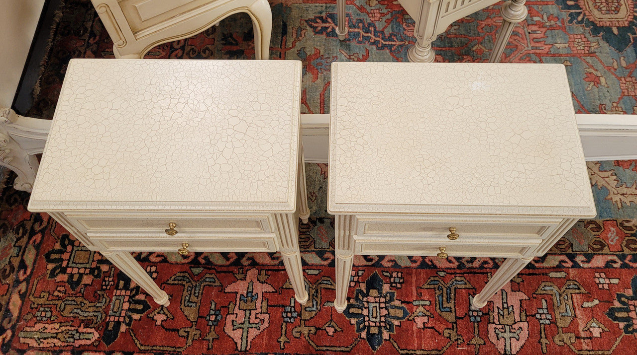 Pair of Vintage Louis 16th style painted crackle finish two drawer French style bedsides. They have elegant reeded legs and have been sourced from France. They are in good original condition.