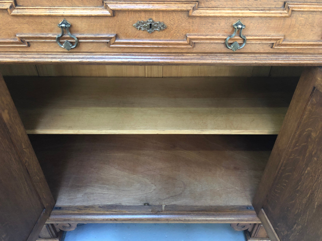 Beautiful carved French Oak four-door buffet with three drawers and lots of room for storage in good original detailed condition.