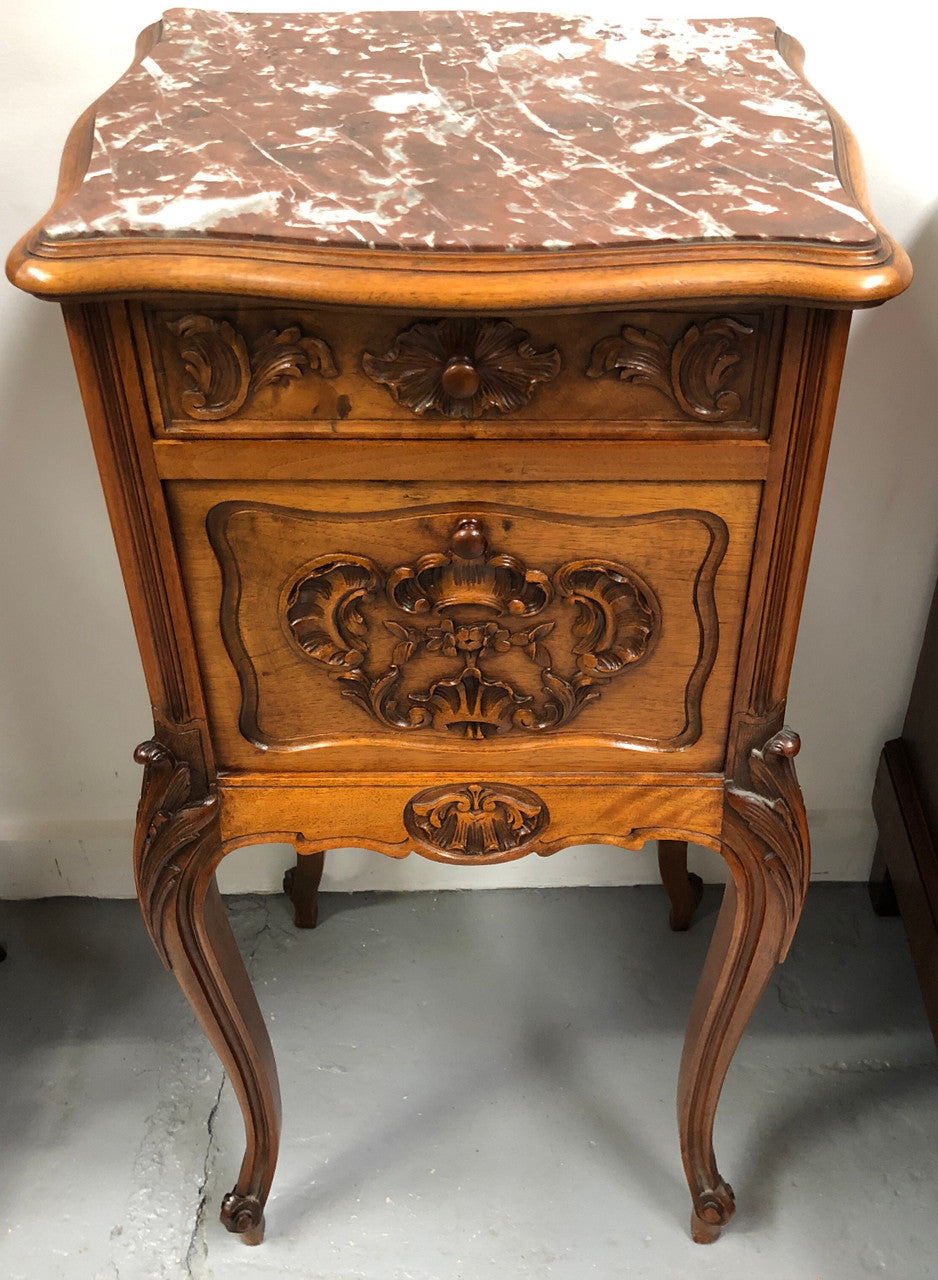 Single French carved bedside with inset marble top. It has beautiful carving and a drawer and cupboard for storage. In very good original detailed condition.