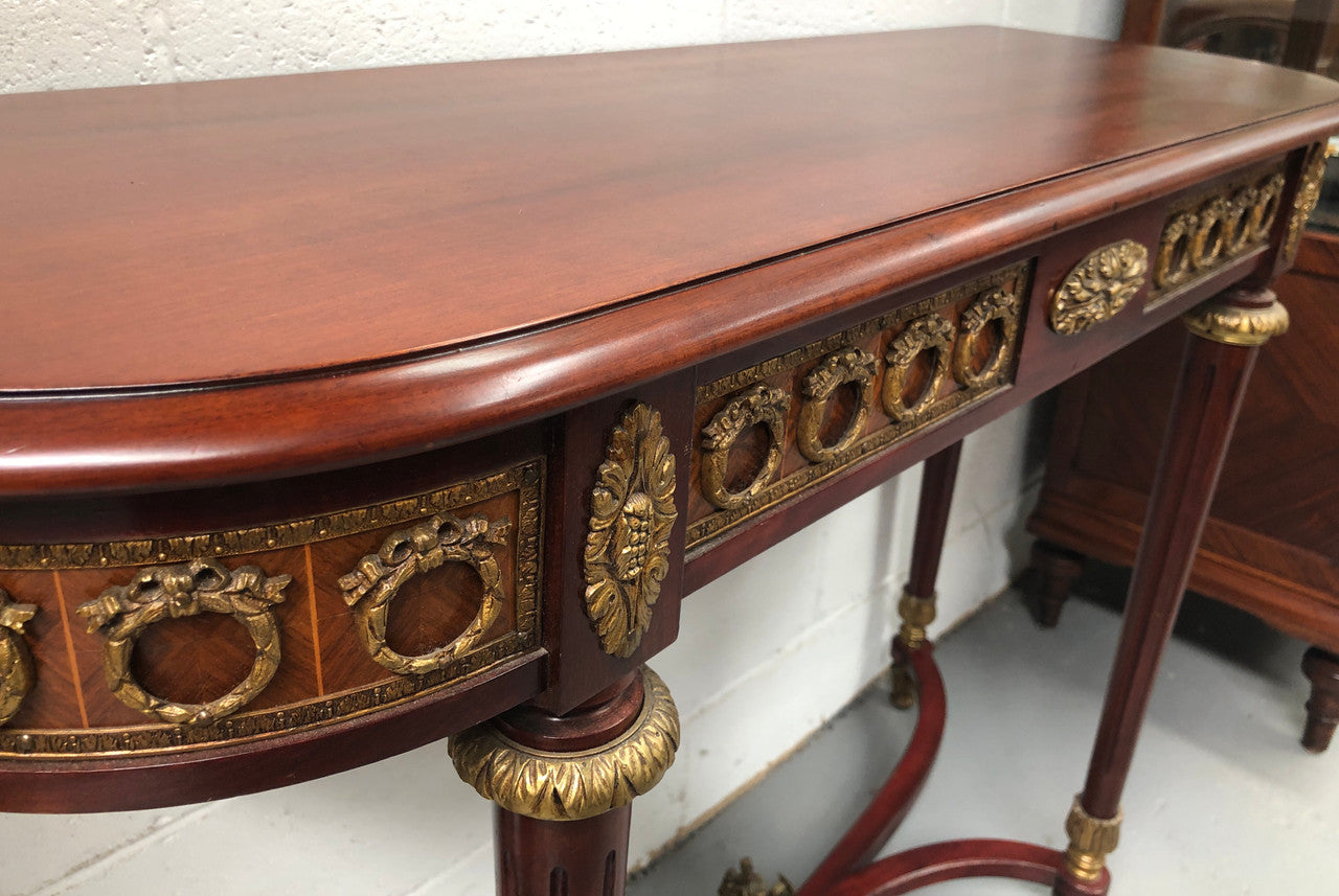 Fully restored decorative French style mahogany console table, with beautiful ormolu mounts and in very good condition.