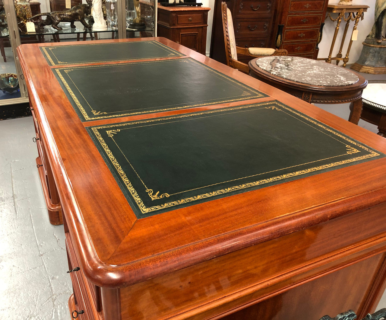 Antique French Mahogany and leather inset top double pedestal partners desk. Plenty of storage space with 9 long drawers on one side and space for someone to sit on the other side. In good restored condition. Circa 1880's.