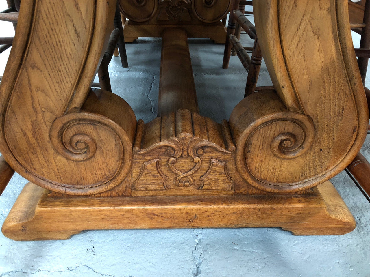 French oak fixed farmhouse table with a charming harp-shaped base. In good original condition and can seat 6-8 people. Circa 1930.