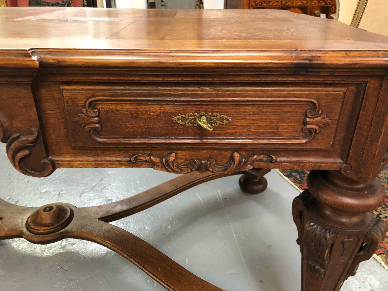 Beautifully carved 19th century French oak Bureau Plat. With a lovely parquetry top and two drawers and decorative carved legs this piece is definitely one to look at . In good original detailed condition.
