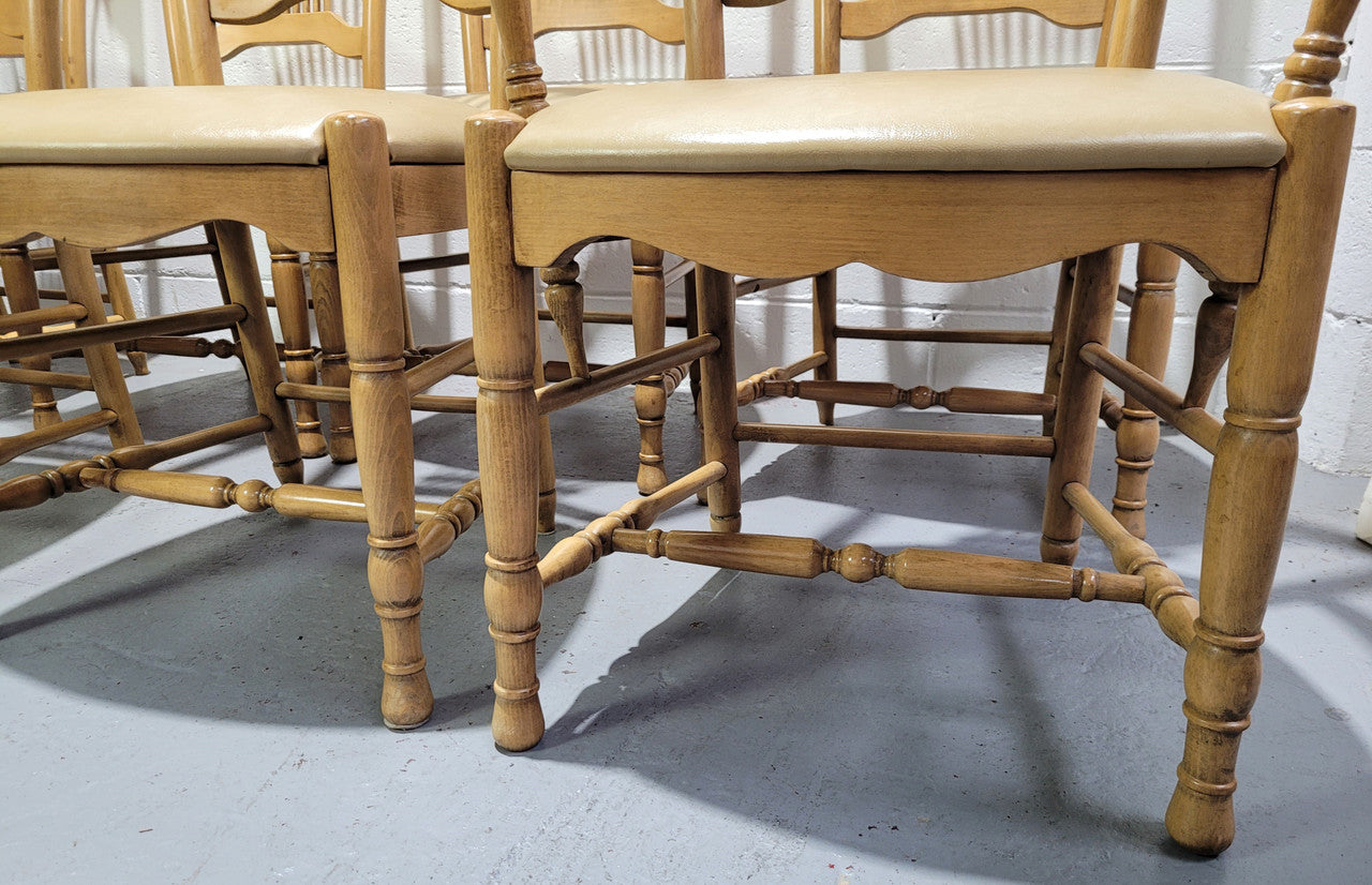 French country style set of six dining chairs and two carvers with leather seats. They are all in good original detailed condition.