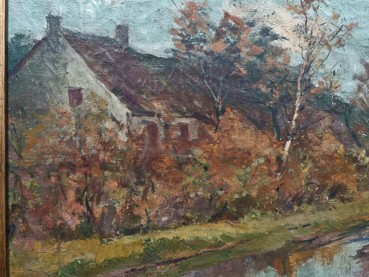 French signed country scene oil on canvas in a lovely decorative frame. In good original condition.