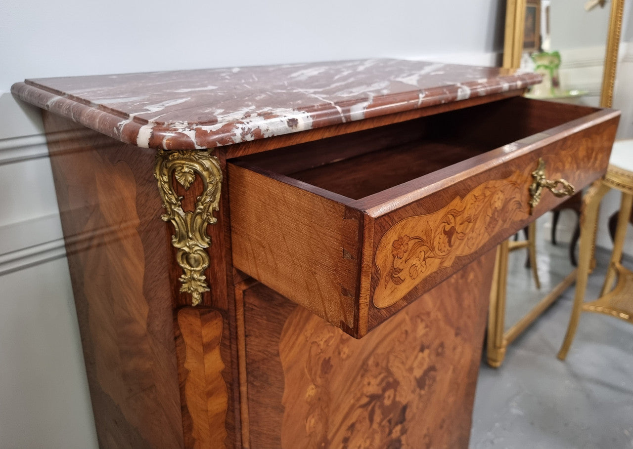 Elegant French transitional style Walnut & Kingwood Salon cabinet. It has beautiful marquetry inlay, a marble top and decorative ormolu mounts. Sourced From France and is in good original detailed condition.