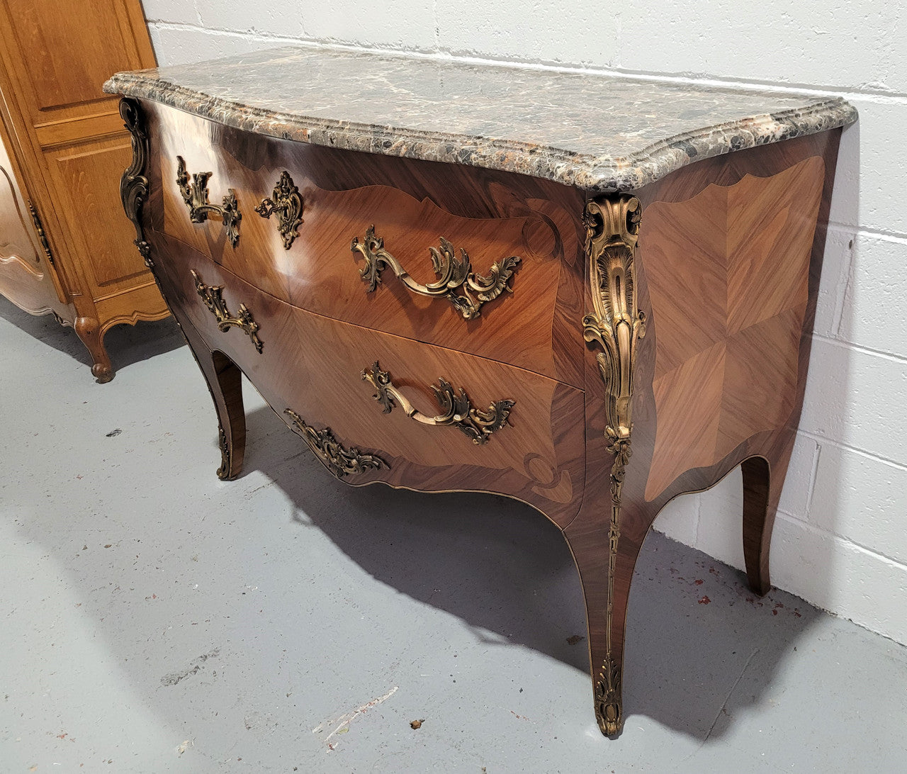 Stunning French Walnut and Rosewood Louis XV style two drawer commode with a beautiful marble top and ormolu mounts. In good original detailed condition.
