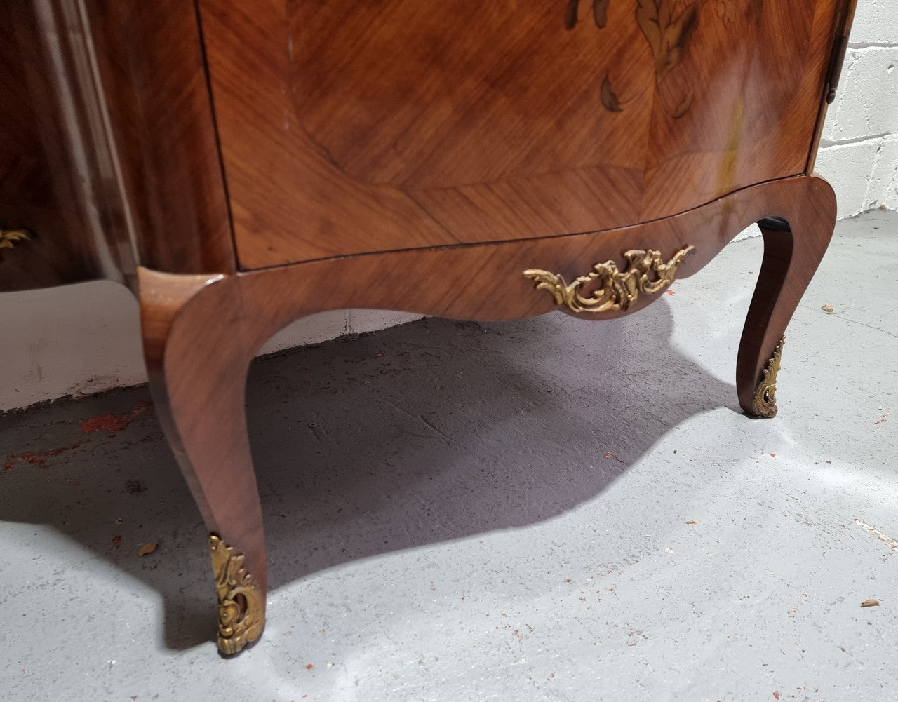 Grand French Walnut Louis XV style marble top vitrine. It has two glass shelfs and one mirrored shelf at the bottom and added storage at bottom. It is in good original detailed condition.