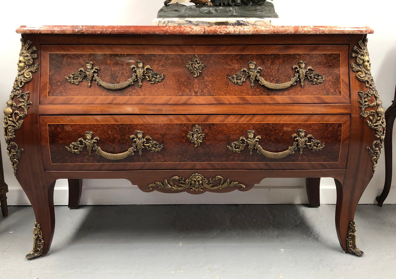 Grande French Louis XIV style Amboyna and walnut two drawer marble top commode, with amazing detailed ormolu mounts, and sienna colour marble top. In good original detailed condition.