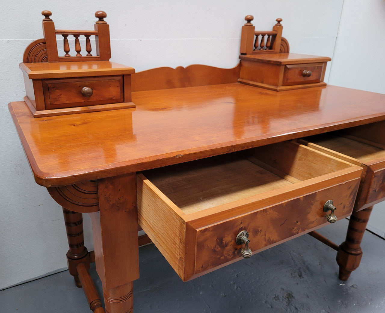 Late Victorian Huon Pine desk with two drawers. Featuring superb birdseye panels and is in good original detailed condition.