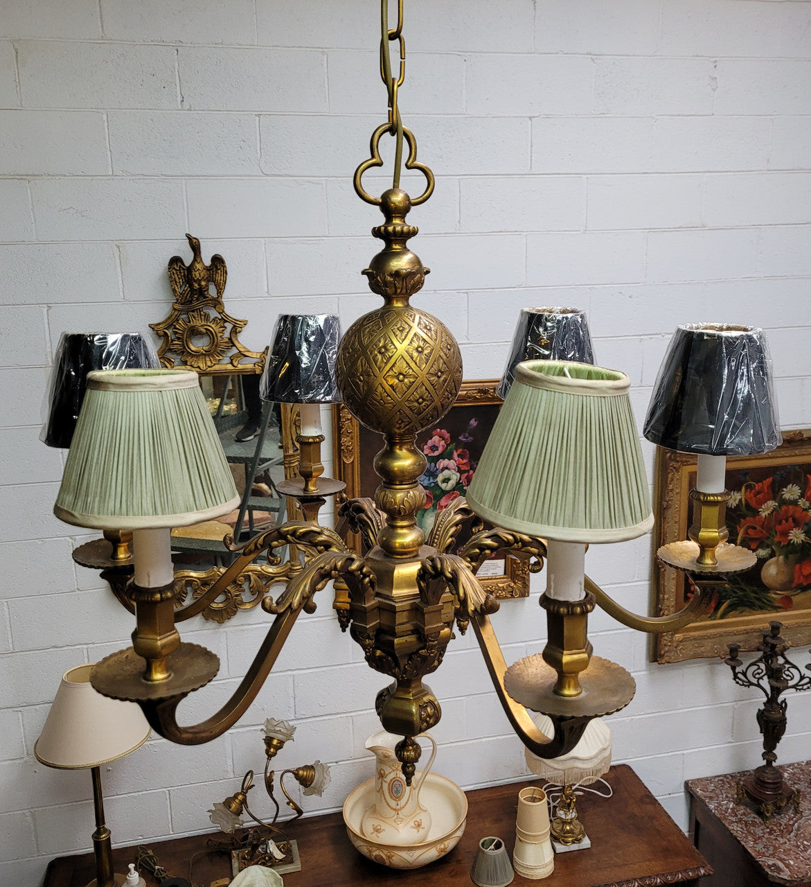 Stunning six arm French bronze chandelier. It can be used with or without shades. It has been fully rewired to Australian standards. It is in good original detailed condition.