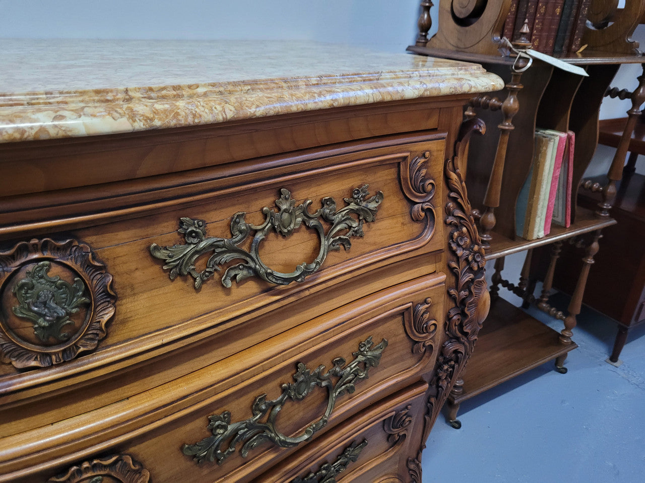 Impressive Louis XV style three drawer walnut commode. Ormolu handles and bevelled marble top complimenting detailed carving. In very good original detailed condition.