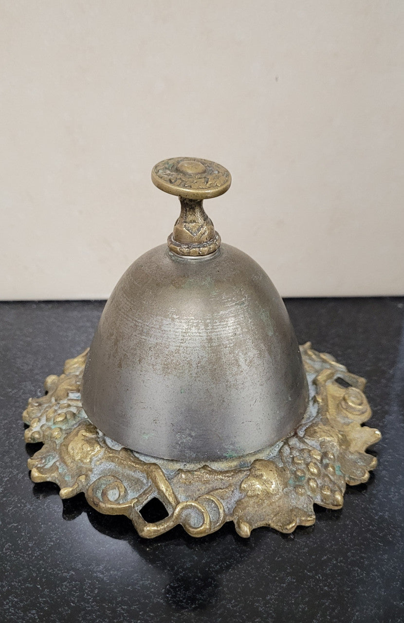 Vintage brass and white metal stone counter bell with a great ring, Circa 1920's. It is in great original condition. Please see photos as it forms part of the description.